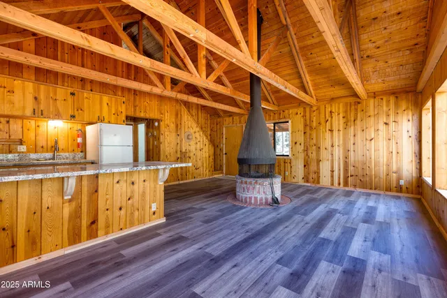 a view of front door with wooden floor and chair