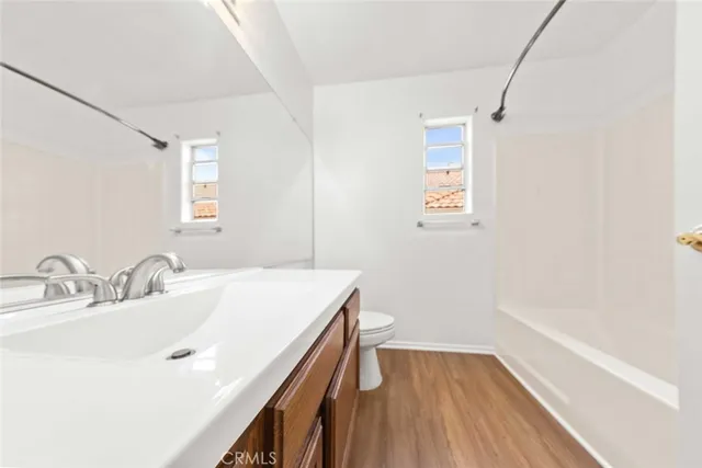 a bathroom with a sink a mirror and a bathtub