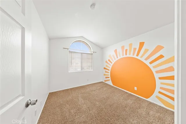 a view of a room with cabinet and mirror