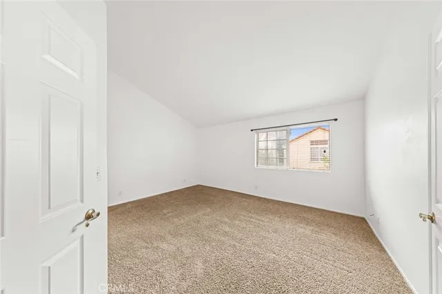 an empty room with a empty space and windows