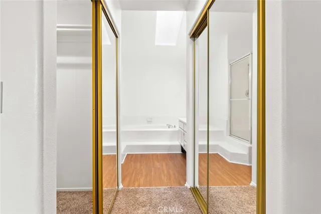 a bathroom with a glass shower door