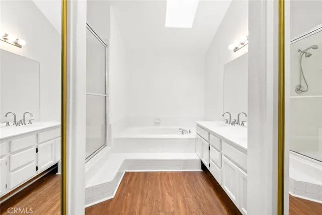 a bathroom with a bathtub and a sink