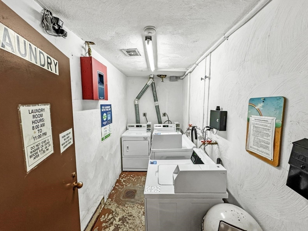 305 Riverside Avenue, Unit 24 Medford, MA 02155 - Photo 10 of 11 a living room with furniture and a chandelier