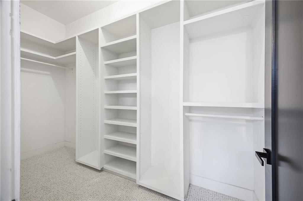 6465 Yacht Club Road Flowery Branch, GA 30542 - Photo 28 of 45 a view of an empty walk in closet