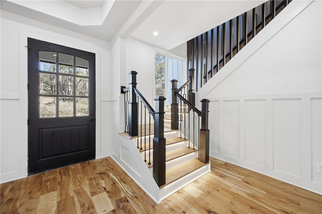 6465 Yacht Club Road Flowery Branch, GA 30542 - Photo 30 of 45 a view of entryway and hall with wooden floor
