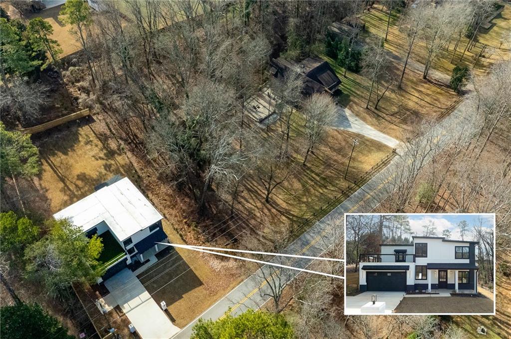 6465 Yacht Club Road Flowery Branch, GA 30542 - Photo 6 of 45 an aerial view of house with yard