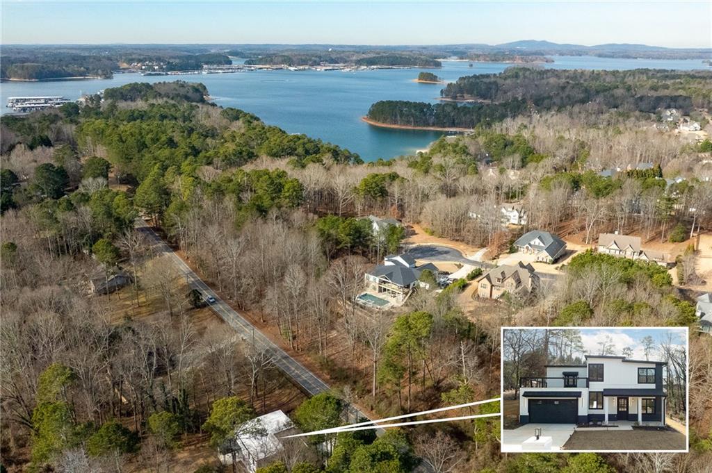 6465 Yacht Club Road Flowery Branch, GA 30542 - Photo 7 of 45 a view of a lake with a mountain