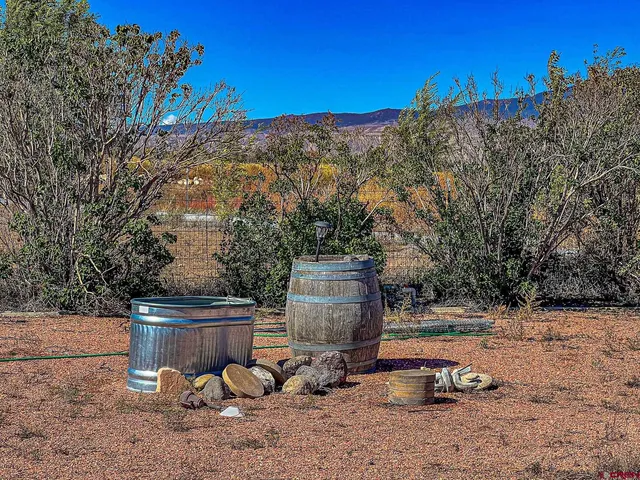 a view of a backyard with sitting area