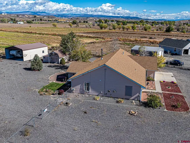 an aerial view of a house with a outdoor space