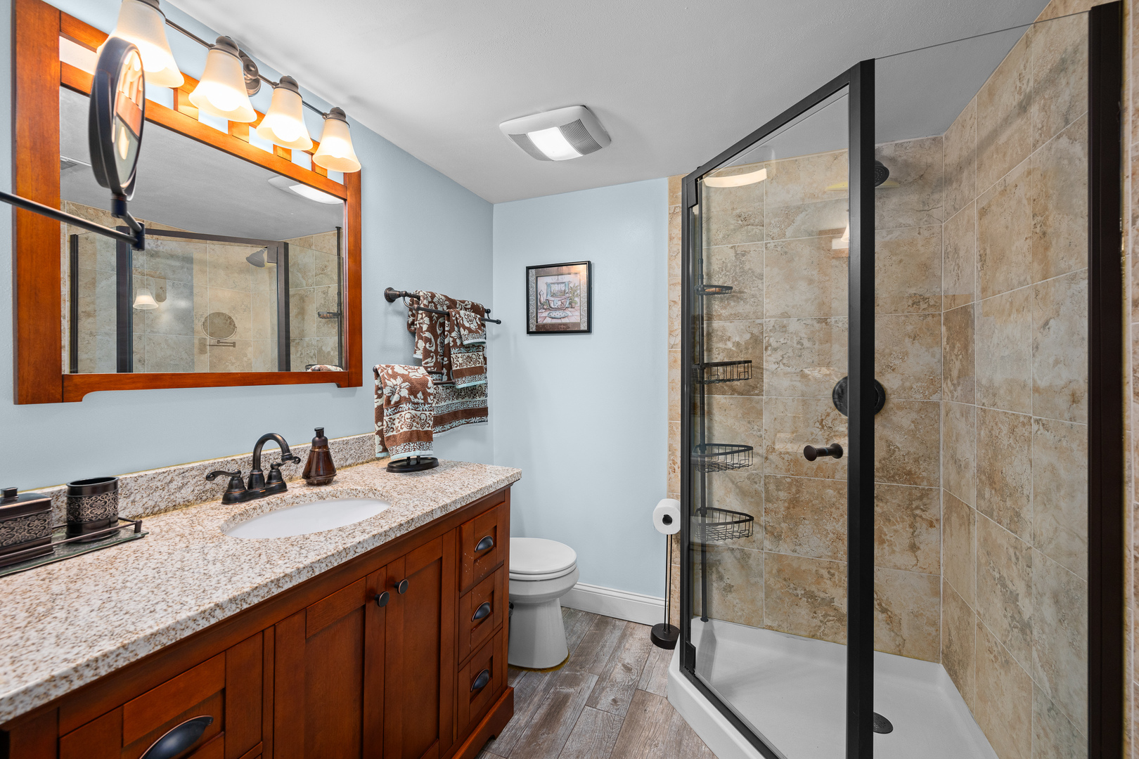506 Bush Street Reynolds, IL 61279 - Photo 25 of 37 a bathroom with a granite countertop sink mirror and a shower
