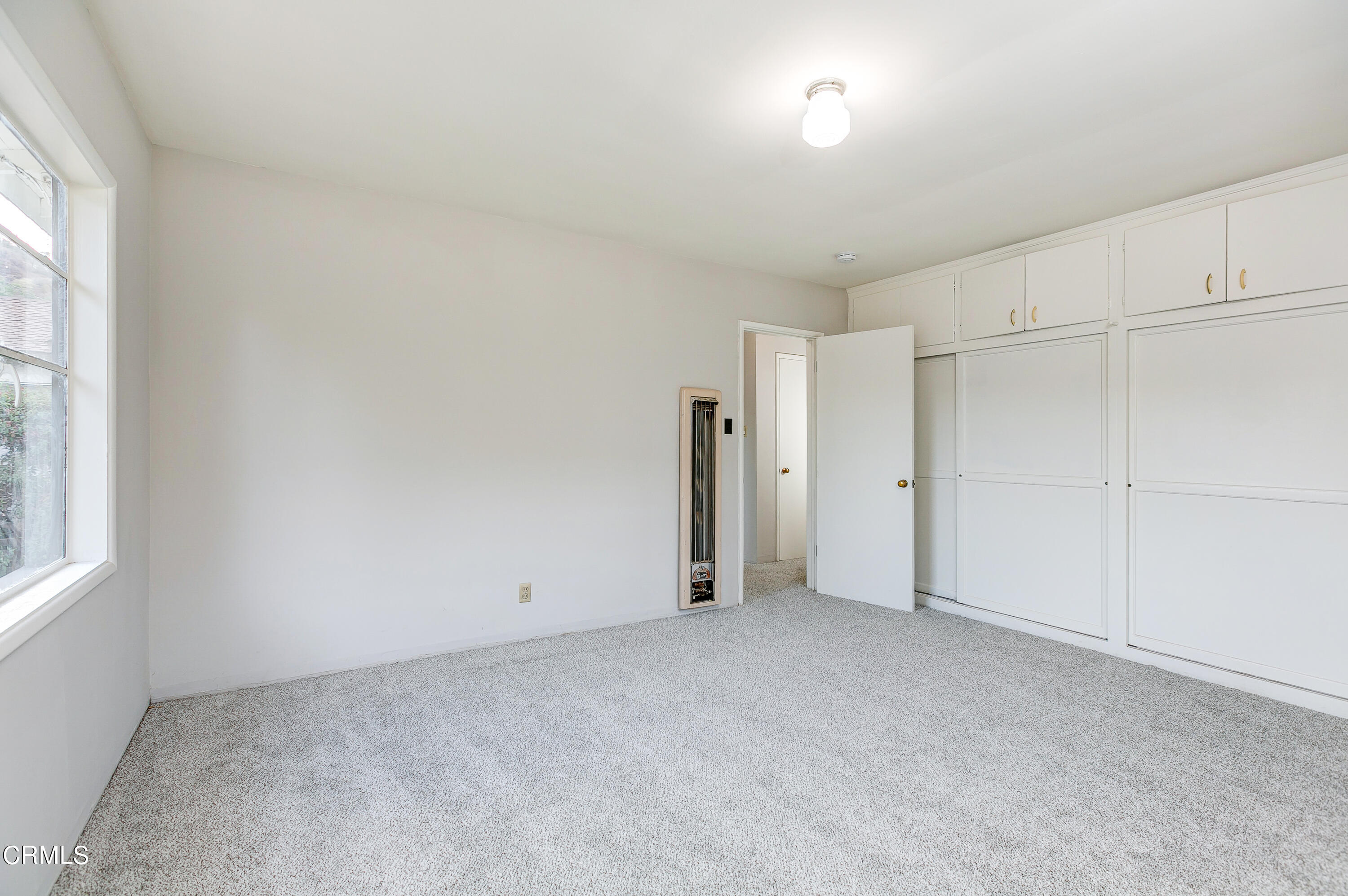 1422 Mildine Drive Glendale, CA 91208 - Photo 14 of 18 an empty room with a empty space and windows