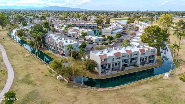 an aerial view of residential houses with outdoor space