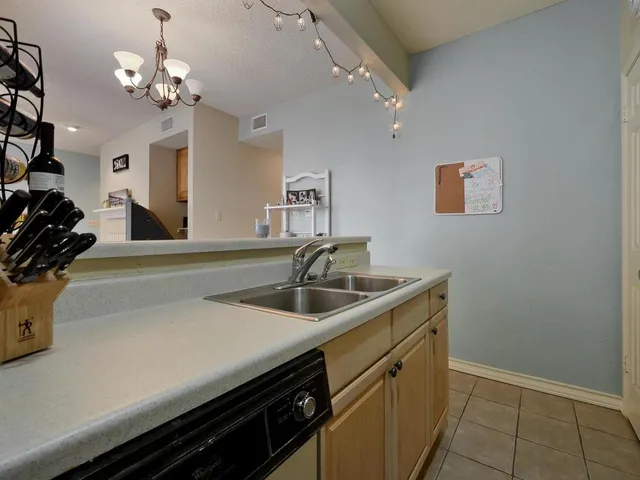 a kitchen with a sink and a stove