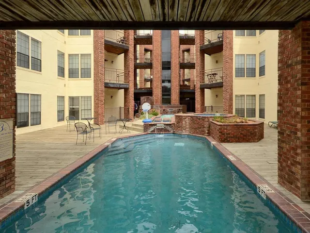 a view of pool with outdoor seating
