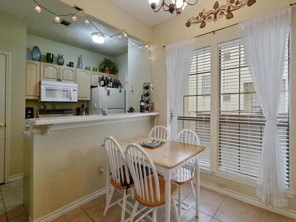 3001 Cedar Street, Unit 117 Austin, TX 78705 - Photo 6 of 25 a dining room with furniture and window