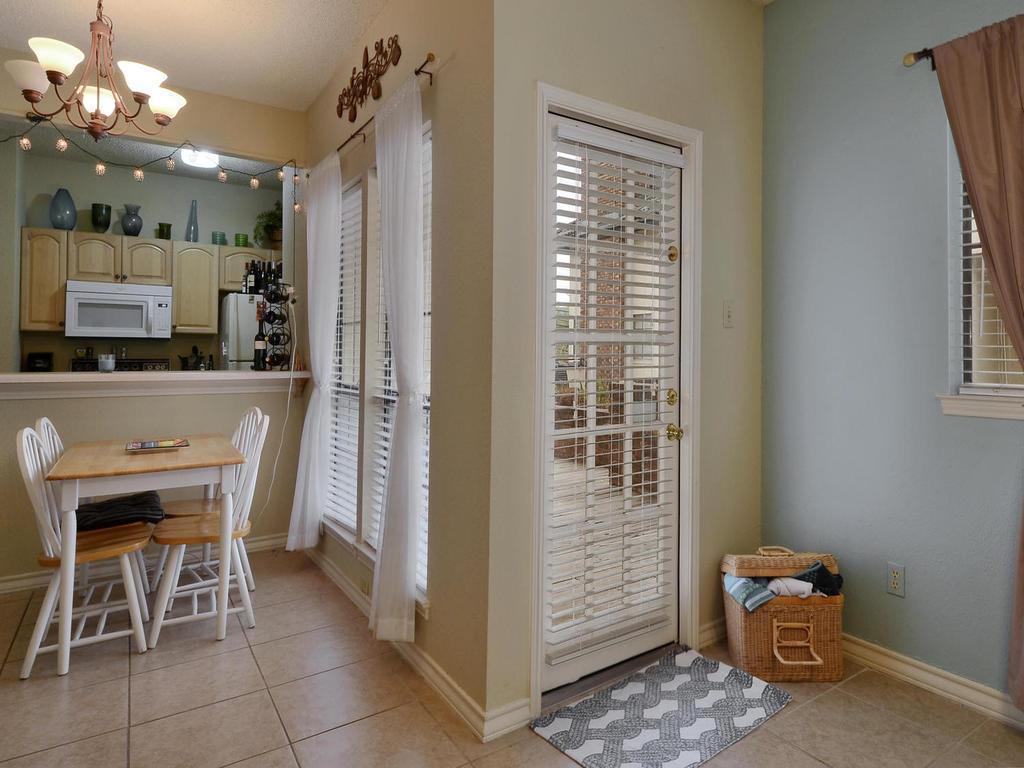 3001 Cedar Street, Unit 117 Austin, TX 78705 - Photo 8 of 25 a dining room with furniture and window