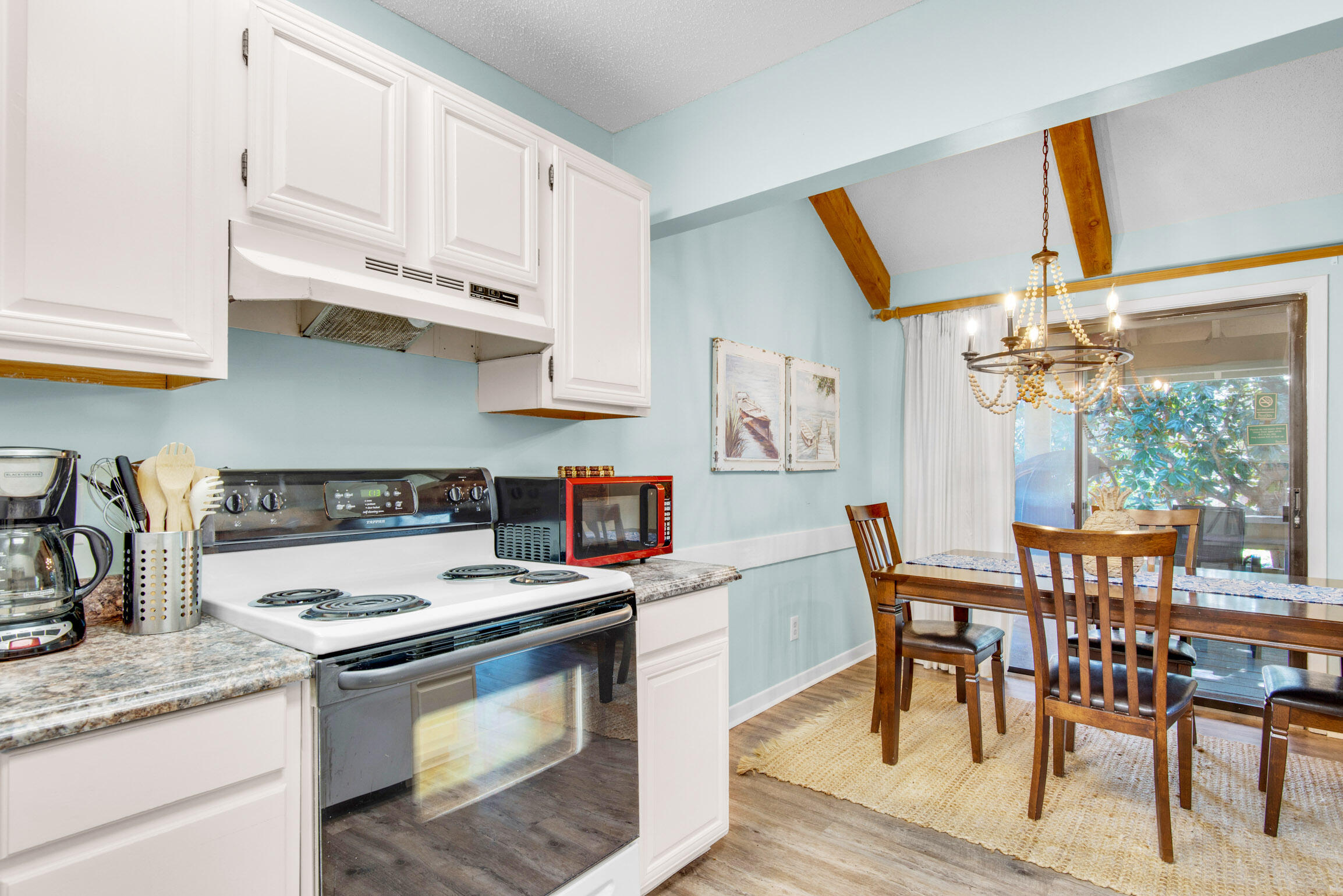 140 Sunset Bay, Unit 12D Miramar Beach, FL 32550 - Photo 14 of 29 a kitchen with stainless steel appliances granite countertop a stove a sink dishwasher and cabinets with wooden floor