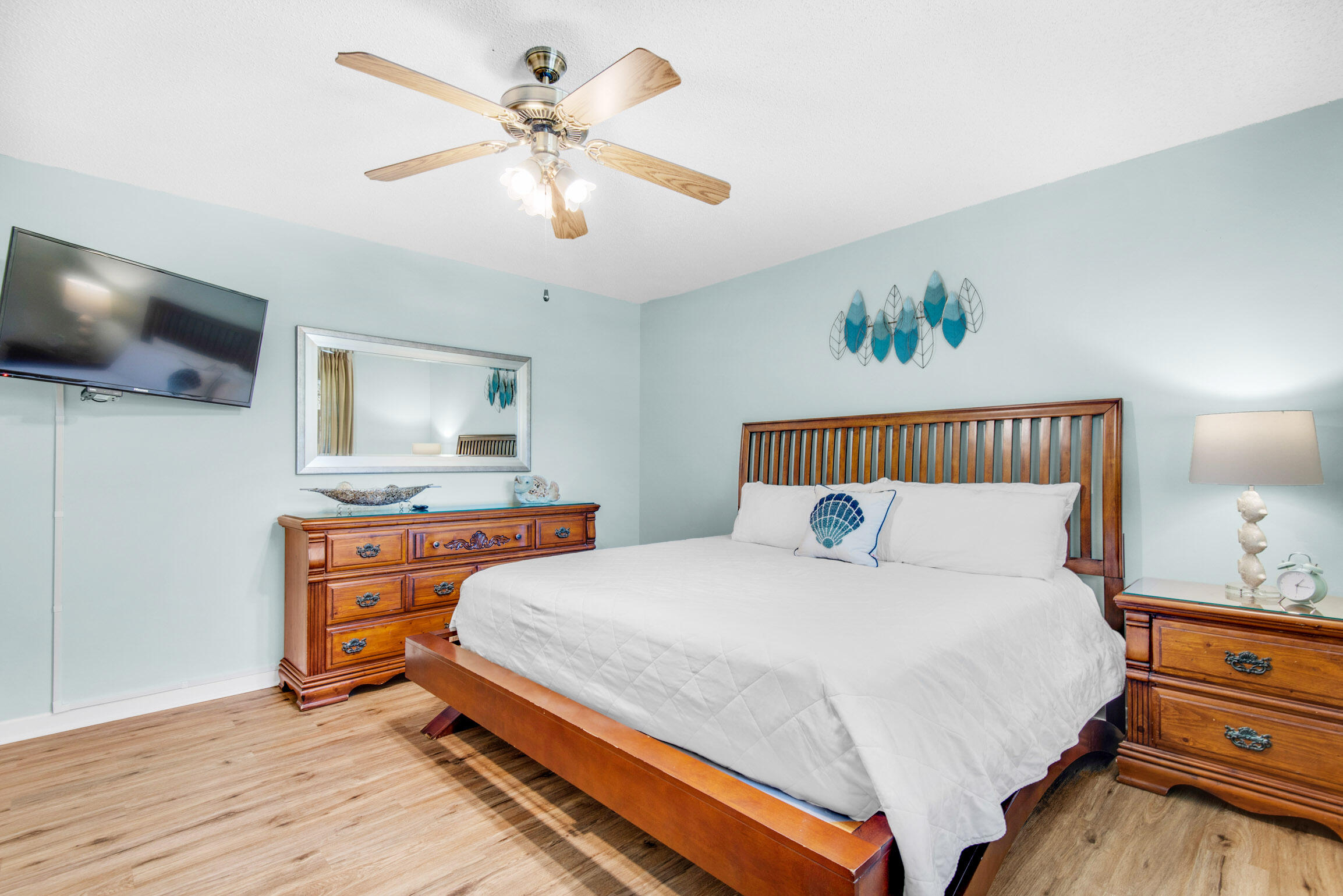 140 Sunset Bay, Unit 12D Miramar Beach, FL 32550 - Photo 17 of 29 a bedroom with a bed and a flat screen tv