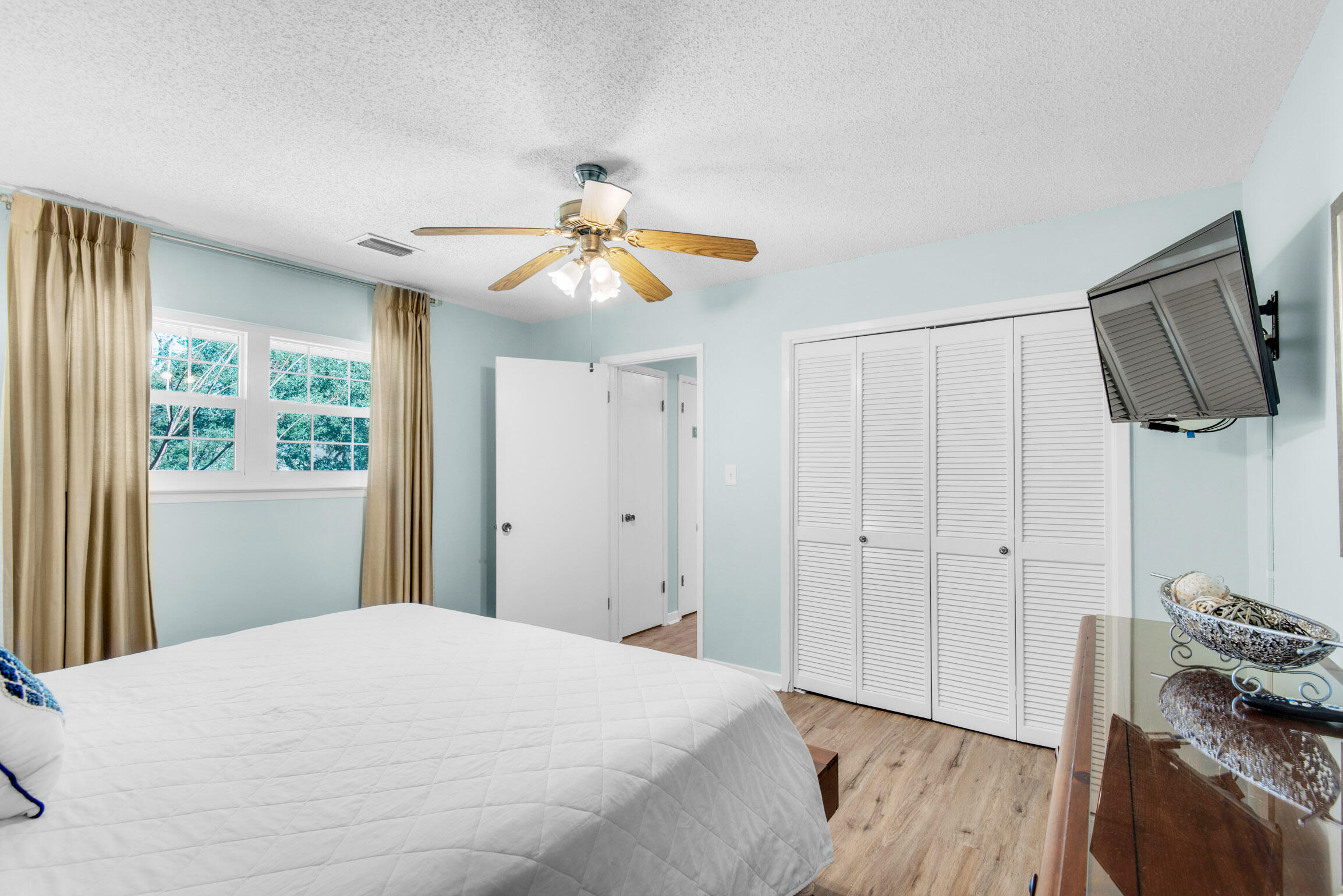 140 Sunset Bay, Unit 12D Miramar Beach, FL 32550 - Photo 18 of 29 a bedroom with a bed and a flat screen tv