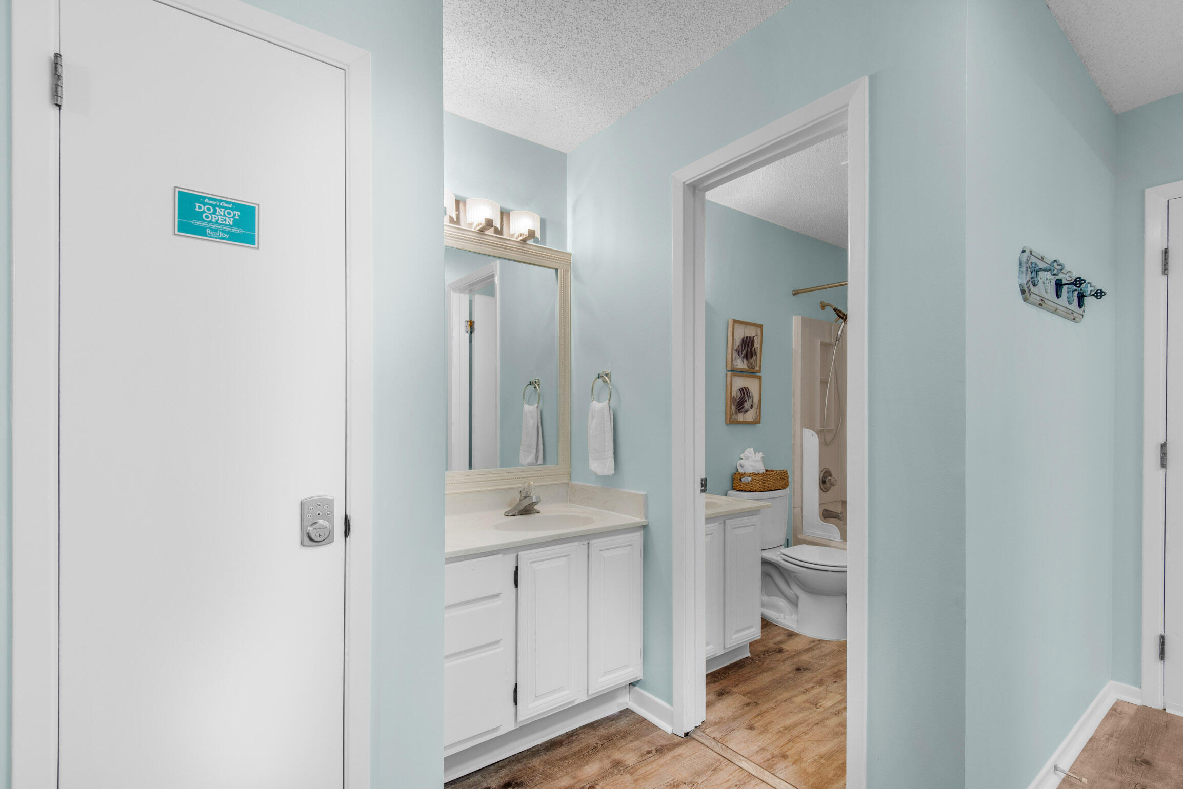 140 Sunset Bay, Unit 12D Miramar Beach, FL 32550 - Photo 20 of 29 a bathroom with a granite countertop sink mirror and toilet