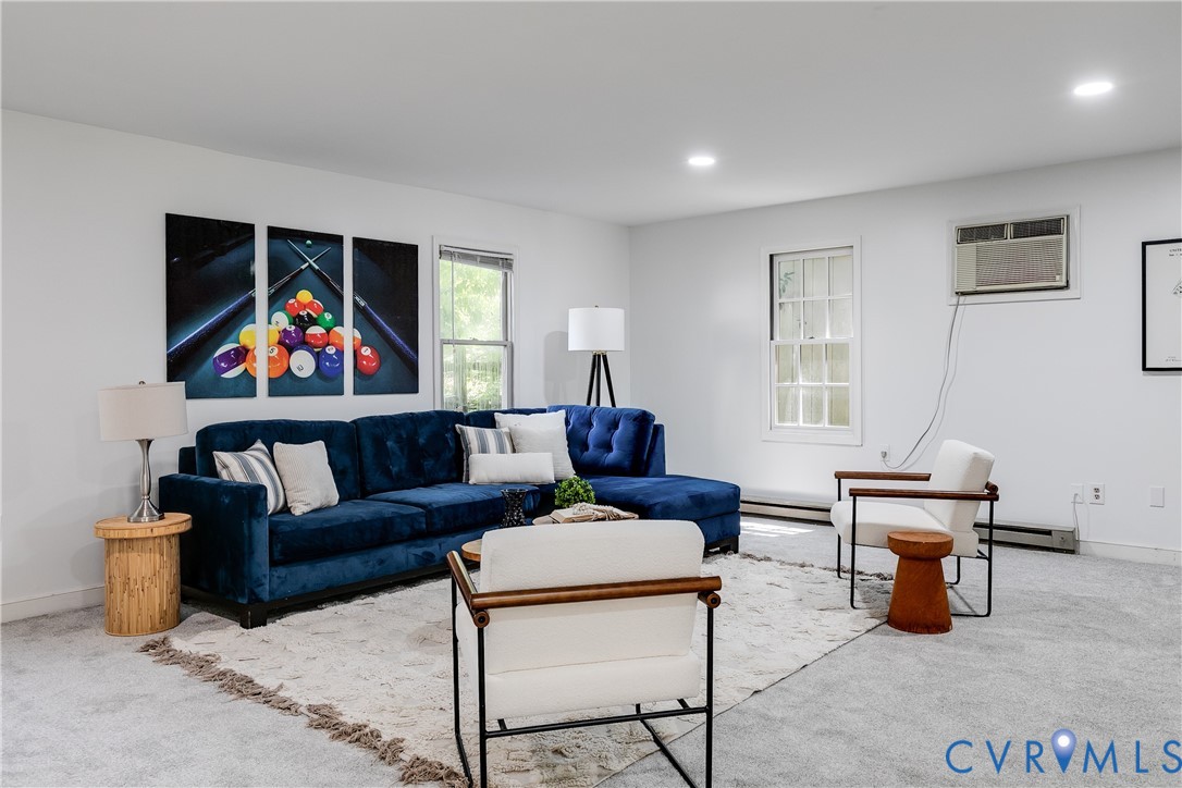 509 Wadeward Road Henrico, VA 23229 - Photo 49 of 59 a living room with furniture a rug and a window