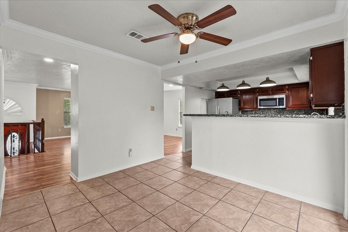 430 Redway Lane Houston, TX 77598 - Photo 19 of 43 a view of a kitchen with furniture and wooden floor