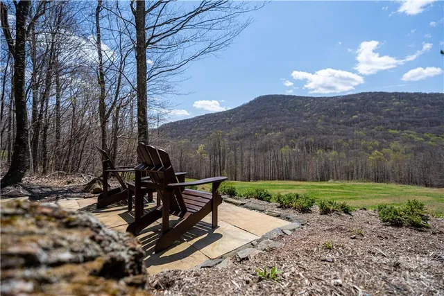 a view of a chairs and table in the patio