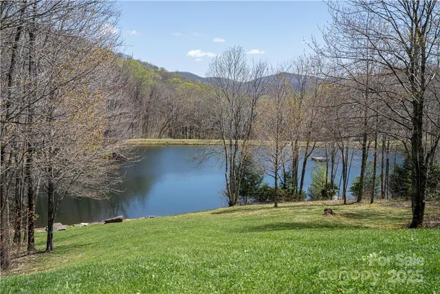 a view of a patio with dining table and chairs with a fire pit