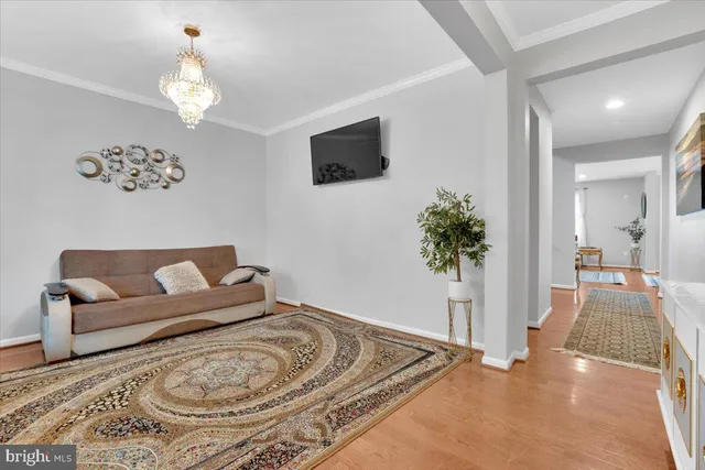 a spacious bedroom with a bed and a flat screen tv