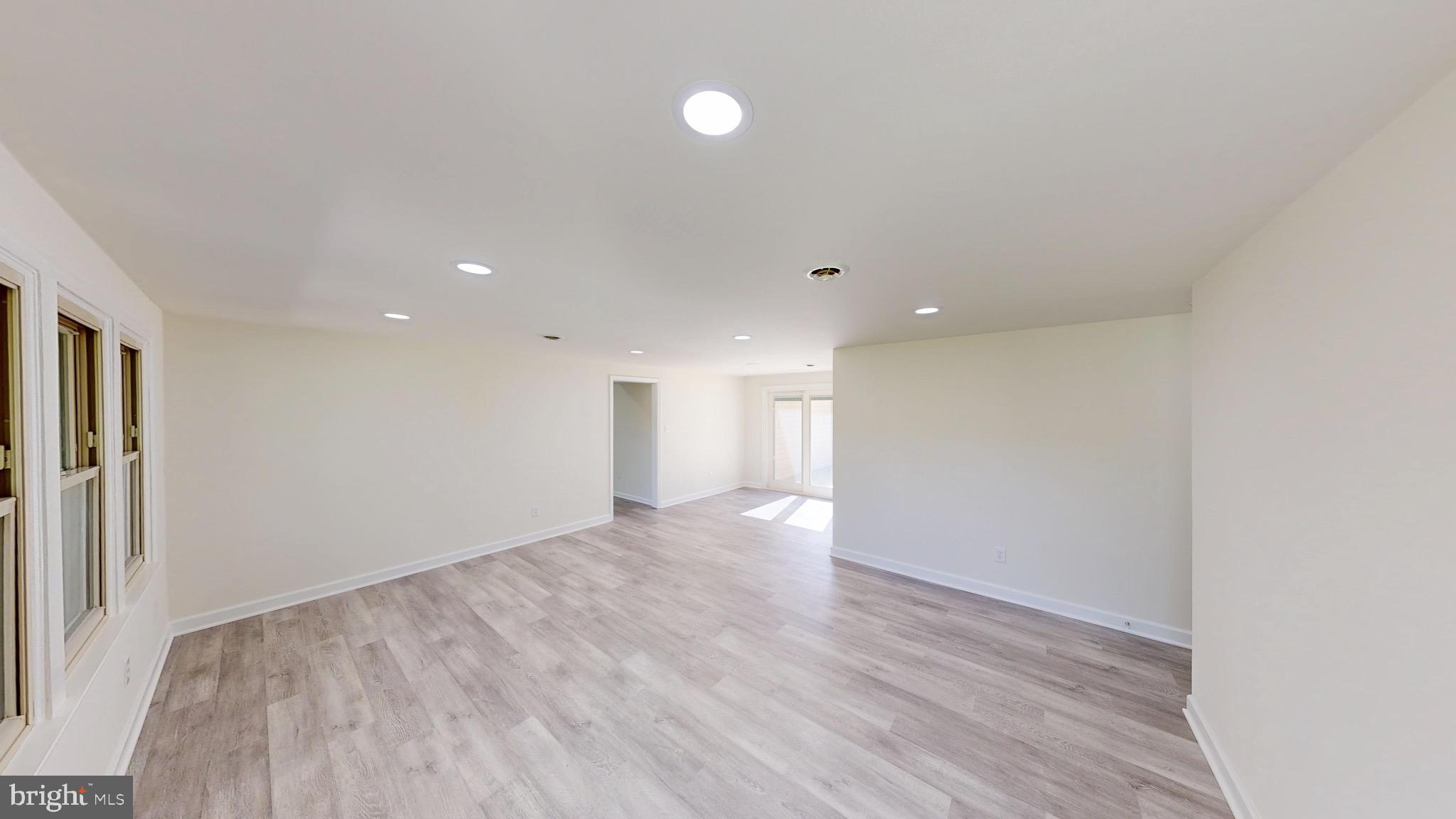 729 West Watersville Road Mount Airy, MD 21771 - Photo 5 of 42 a view of an empty room with wooden floor