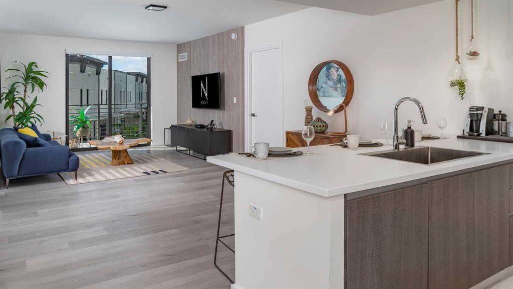 425-475 East Atlantic Boulevard, Unit 410 Pompano Beach, FL 33060 - Photo 21 of 40 a view of living room with fireplace furniture and a large window