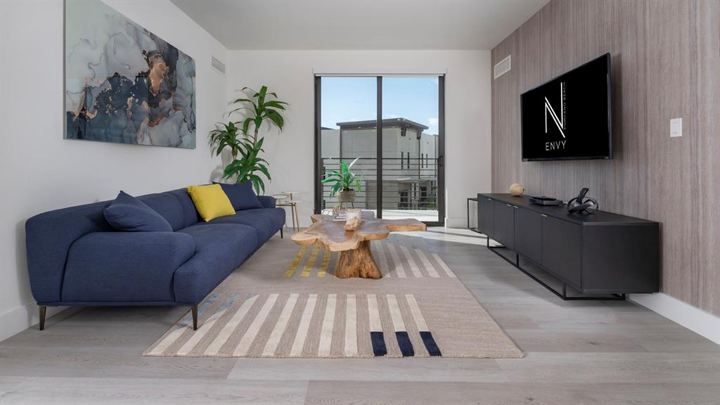 425-475 East Atlantic Boulevard, Unit 410 Pompano Beach, FL 33060 - Photo 22 of 40 a living room with furniture and a flat screen tv