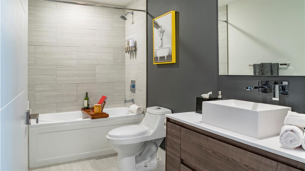 425-475 East Atlantic Boulevard, Unit 410 Pompano Beach, FL 33060 - Photo 29 of 40 a bathroom with a sink a toilet and shower