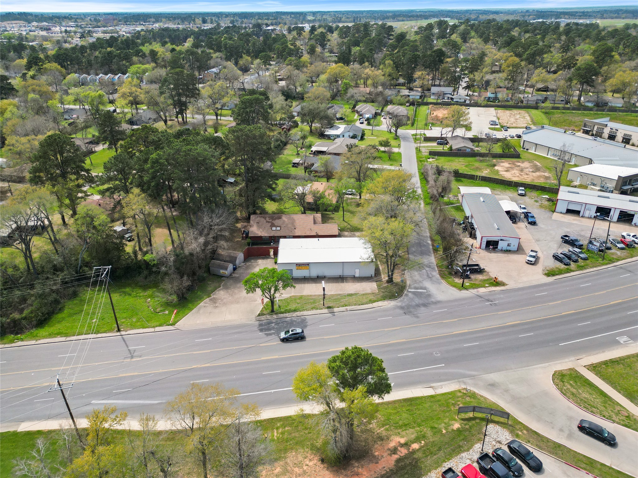 an aerial view of residential houses with outdoor space