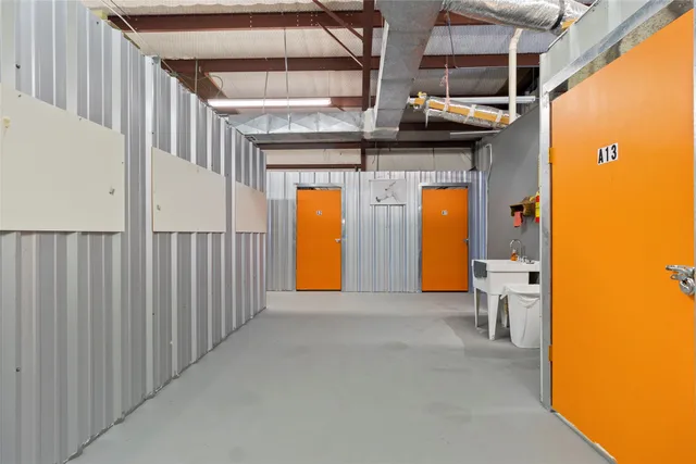 a view of a porch with a table and chairs