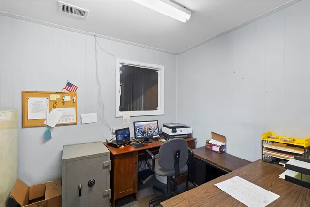 a workspace with furniture and wooden floor