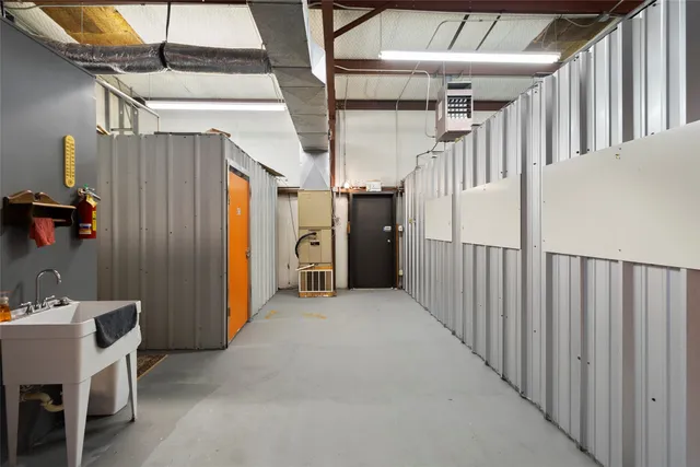 a view of a hallway with stairs