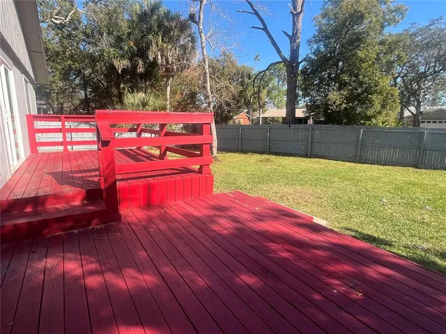 a view of a backyard with wooden floor