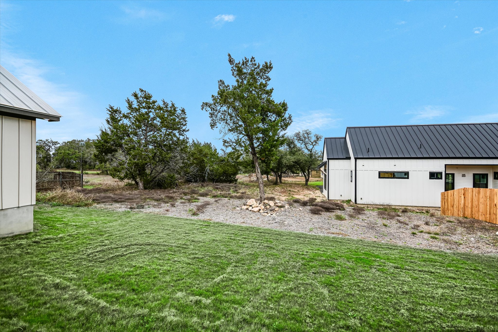 31 Peace Pipe Wimberley, TX 78676 - Photo 19 of 20 View of green lawn featuring an outbuilding