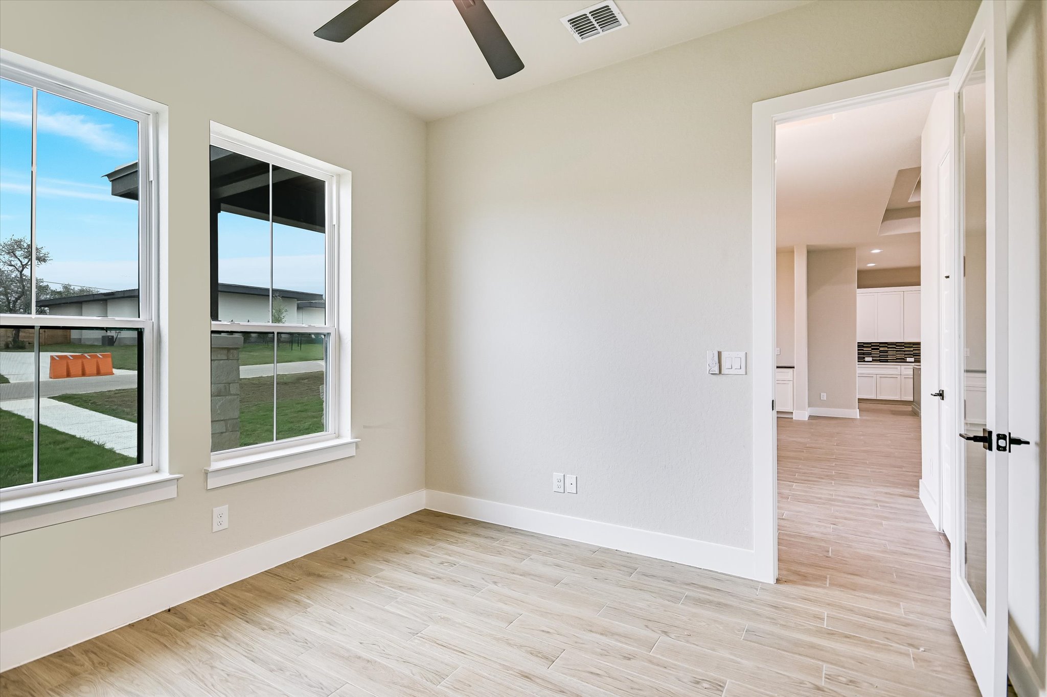 31 Peace Pipe Wimberley, TX 78676 - Photo 2 of 20 Empty room with light wood-type flooring and a ceiling fan
