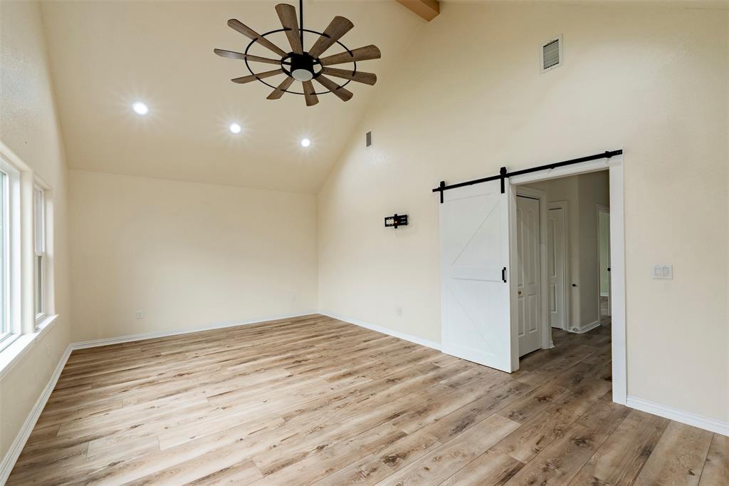 2325 River Road Granbury, TX 76048 - Photo 28 of 40 Barn door in bonus room