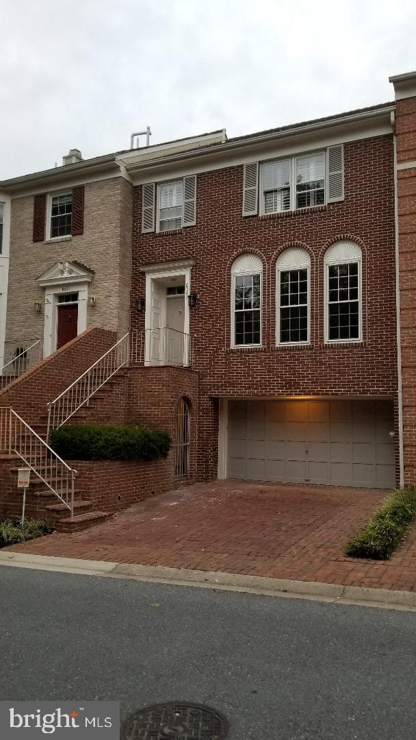 8049 Rising Ridge Road Bethesda, MD 20817 - Photo 1 of 33 a front view of a house with yard