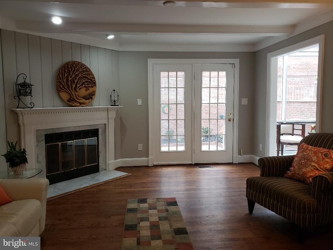 8049 Rising Ridge Road Bethesda, MD 20817 - Photo 12 of 33 a living room with furniture window and a fireplace