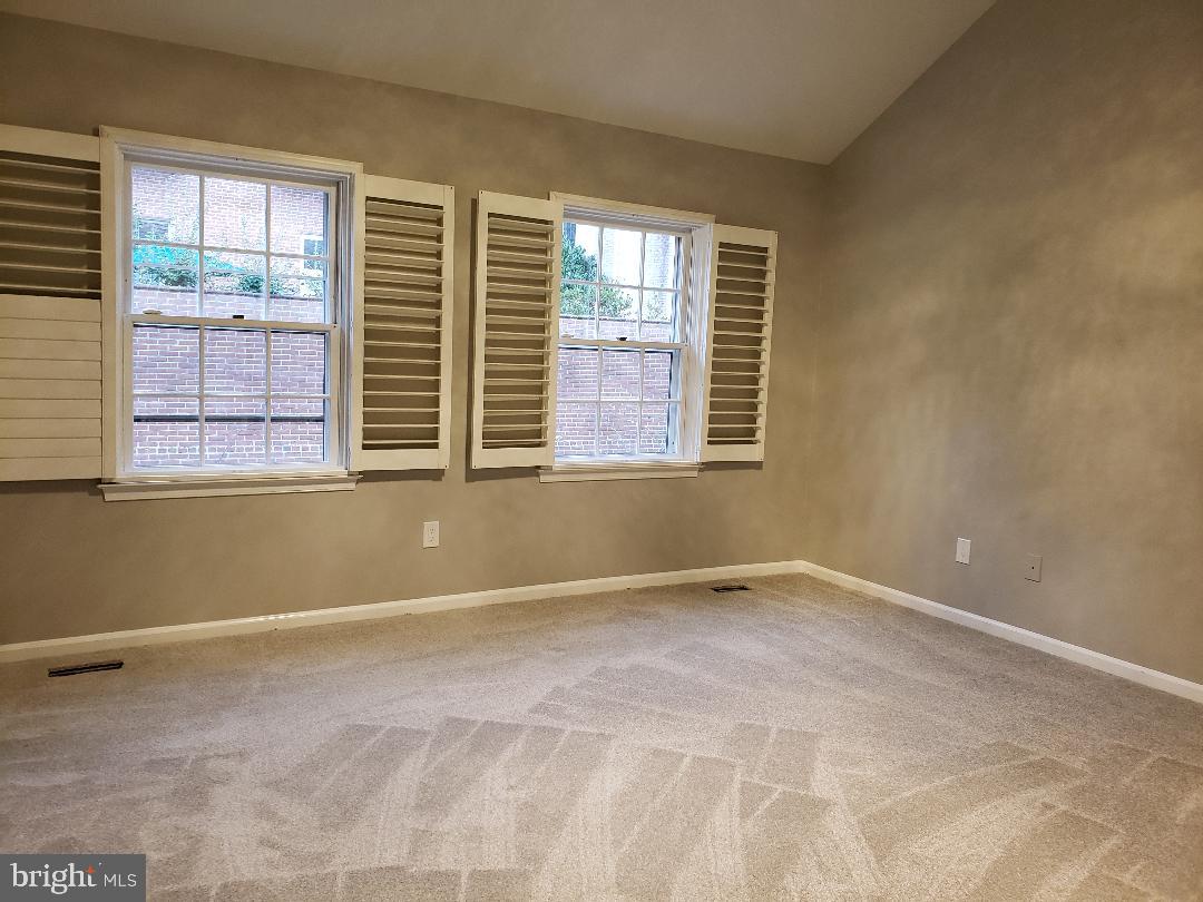 8049 Rising Ridge Road Bethesda, MD 20817 - Photo 17 of 33 a view of an empty room with a window