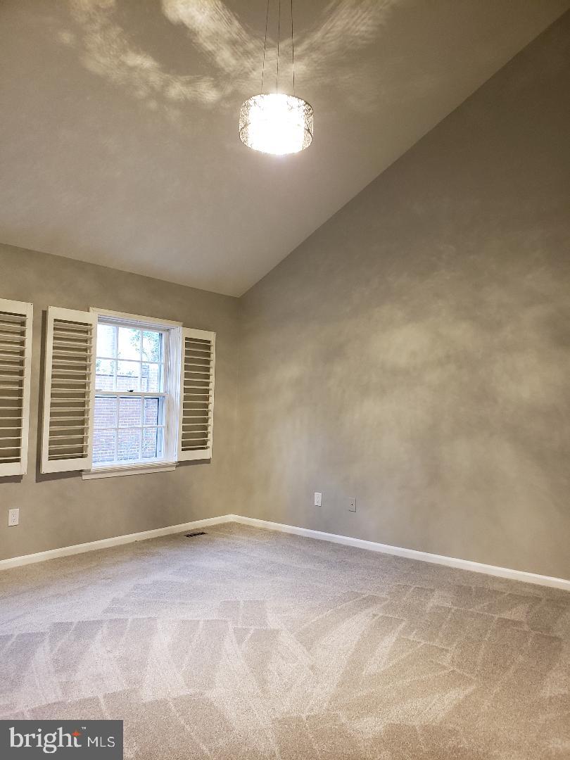 8049 Rising Ridge Road Bethesda, MD 20817 - Photo 18 of 33 a view of an empty room with a window
