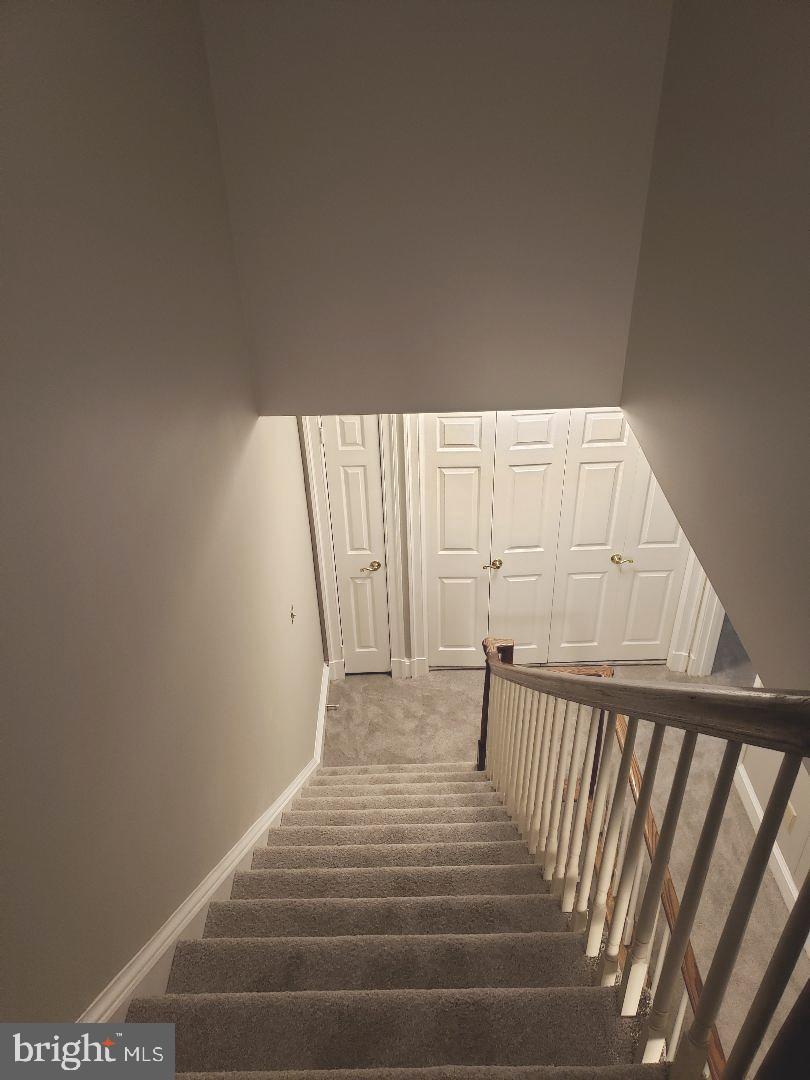 8049 Rising Ridge Road Bethesda, MD 20817 - Photo 25 of 33 a view of a room with wooden floor