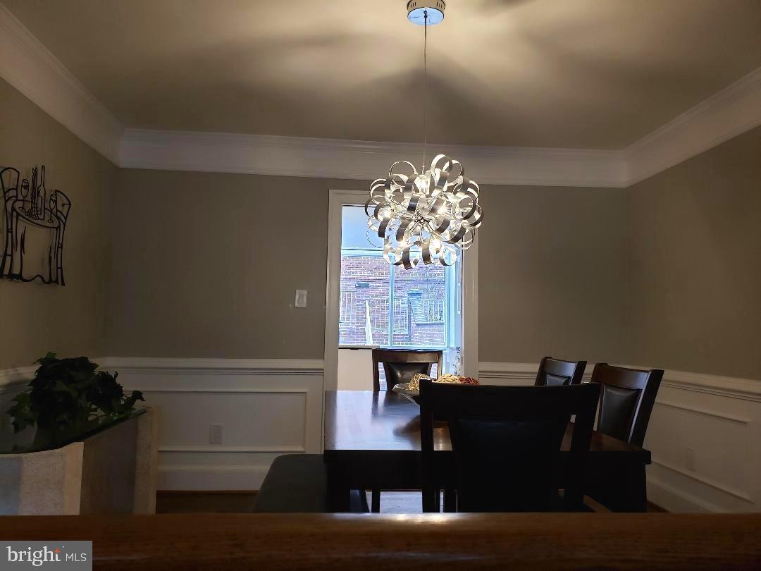 8049 Rising Ridge Road Bethesda, MD 20817 - Photo 7 of 33 a view of a dining room with furniture and chandelier