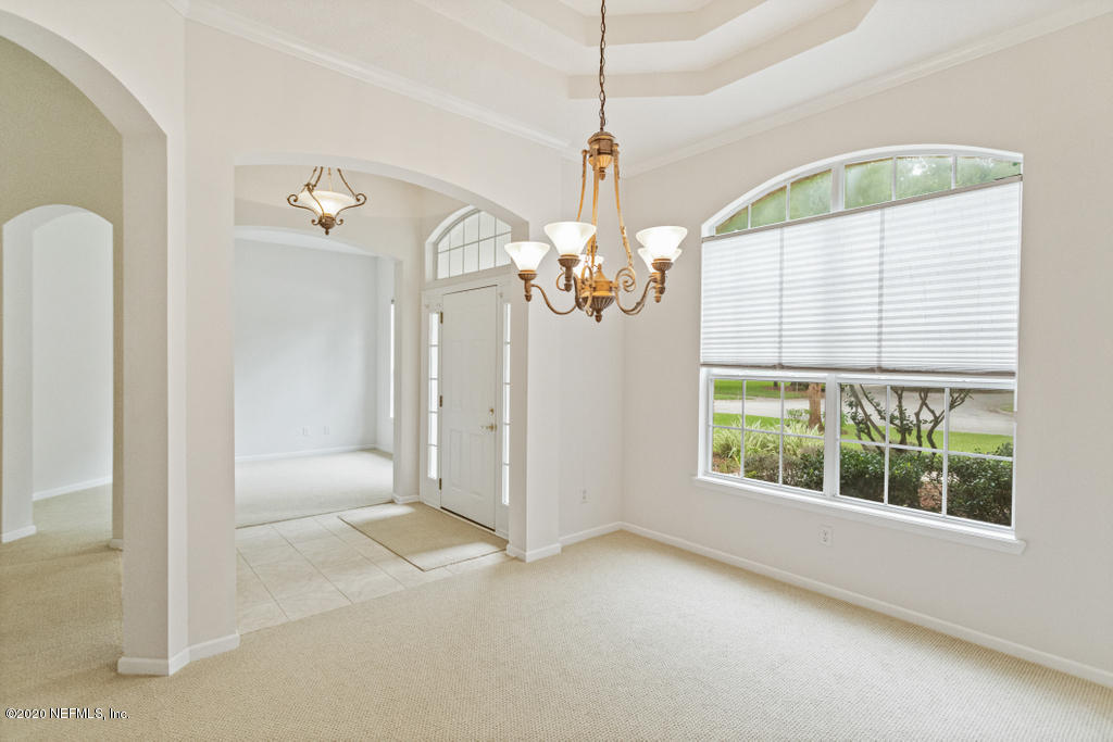 2576 Benjamin Road Jacksonville, FL 32223 - Photo 12 of 53 a view of a livingroom with a chandelier fan and windows