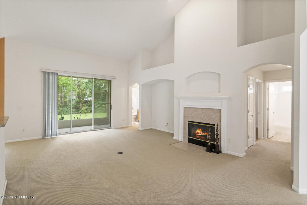 2576 Benjamin Road Jacksonville, FL 32223 - Photo 13 of 53 a view of an empty room with a fireplace