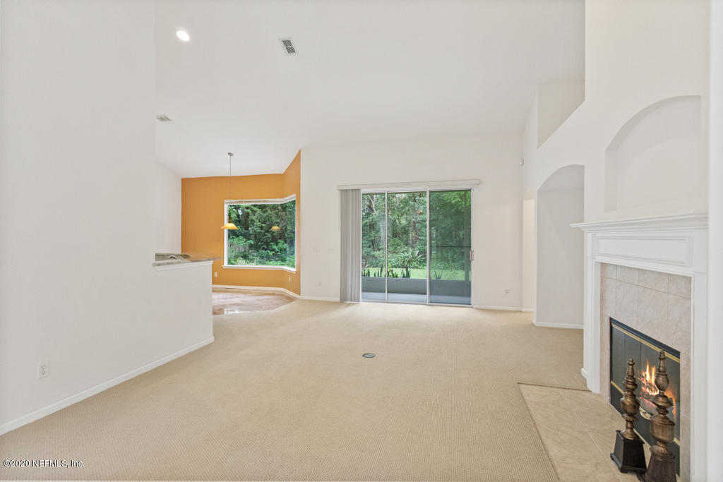 2576 Benjamin Road Jacksonville, FL 32223 - Photo 14 of 53 a view of a livingroom with an empty space and a fireplace